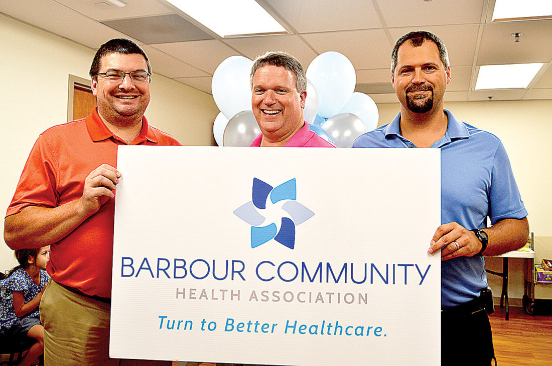 Submitted photo From left, Dr. Cecil Holbert, CEO Eric Ruf and Dr. Pete Palko of Barbour Community Health Association display the organization's new brand during a recent launch event.